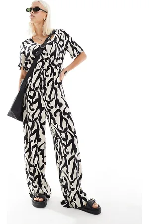 Monki Short sleeve jumpsuit with wrap front in bold mono abstract print