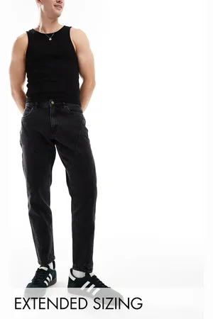ASOS Tapered fit jeans with panelling detail in washed