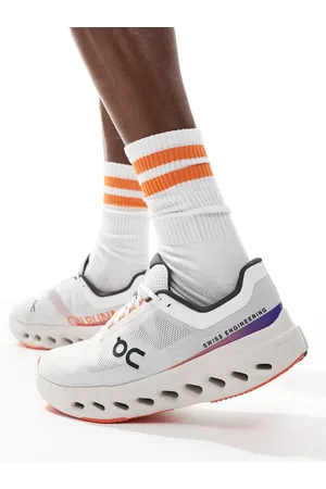 On Running ON Cloudsurfer Next running trainers in and red