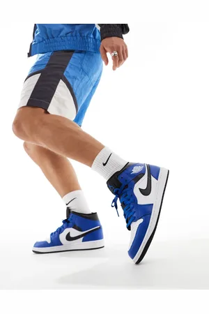 Jordan Air 1 Mid trainers in white, and black