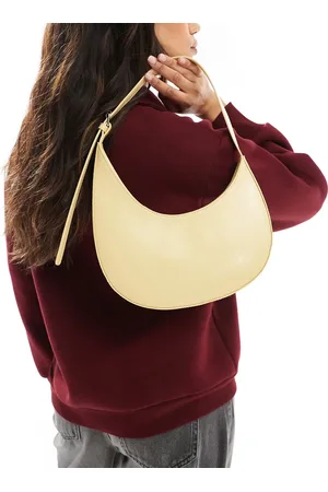 ASOS Asymmetric scoop shoulder bag with buckle detail in buttermilk