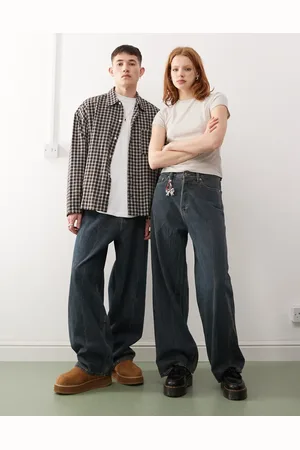 Weekday Astro Unisex low rise loose fit baggy jeans in streaky mid wash