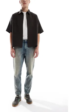 ASOS Tapered jeans with tint in light wash