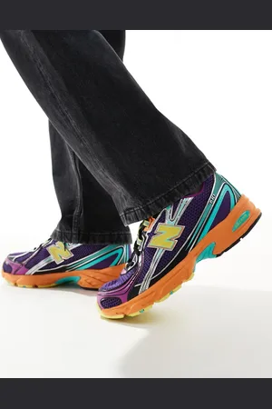 New Balance 740 trainers in and orange