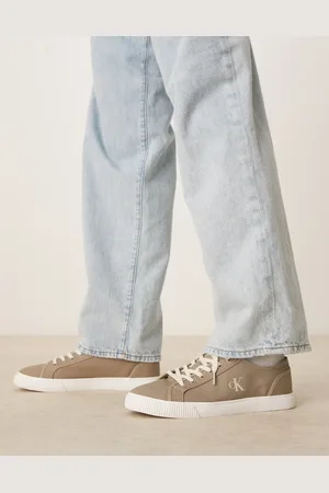 Calvin Klein Essential low canvas trainers in beige and white