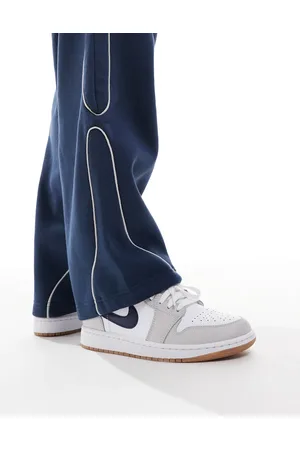 Jordan Nike Air 1 Low trainers in white and navy