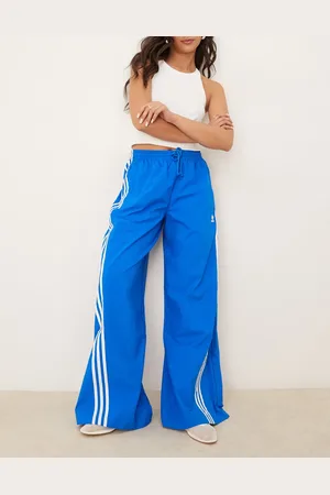 adidas Three stripe oversized track pants in
