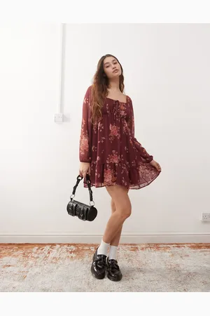 Reclaimed Floaty long sleeve mini dress with tie front in burgundy floral print