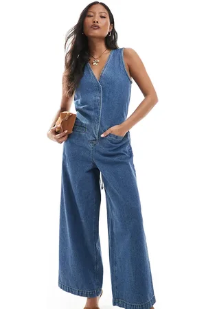 ASOS ASOS DESIGN Petite denim sleeveless loose jumpsuit in midwash