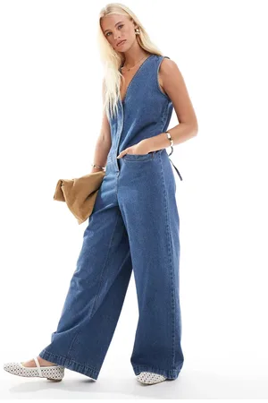 ASOS Denim sleeveless loose jumpsuit in midwash
