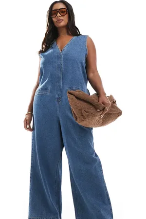 ASOS ASOS DESIGN Curve denim sleeveless loose jumpsuit in midwash