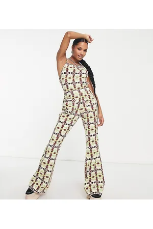 ASOS Petite halter neck jumpsuit with flare leg in geo print