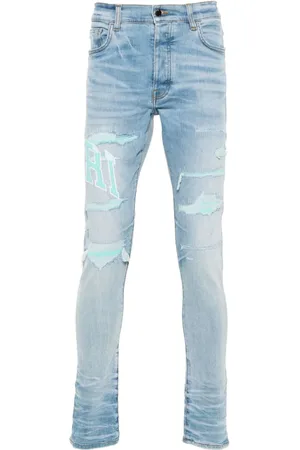 AMIRI Skinny-Jeans im College-Look