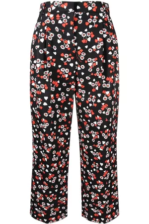 Moschino Damen Jumpsuits - All-over floral-print trousers
