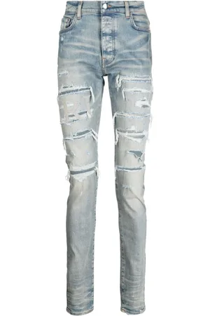 AMIRI Varsity Skinny-Jeans im Distressed-Look