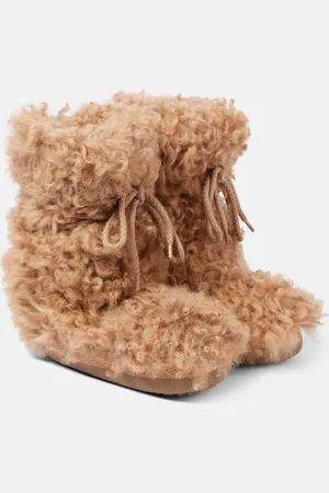 INUIKII Schneestiefel Long Curly High aus Shearling